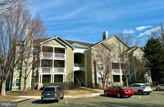 view of property featuring uncovered parking