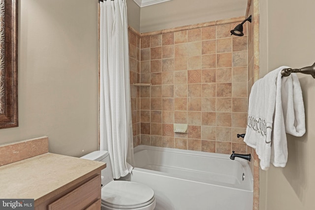 full bathroom featuring vanity, shower / bath combo with shower curtain, and toilet