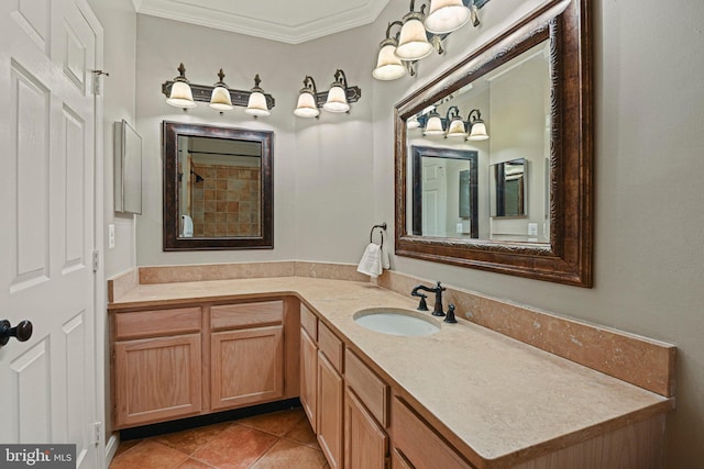 bathroom with tile patterned floors, ornamental molding, and vanity