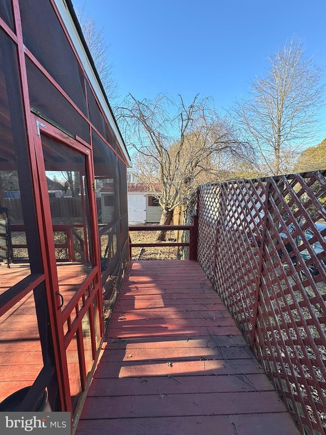 wooden terrace featuring a sunroom