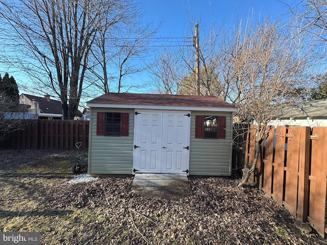 view of shed featuring a fenced backyard