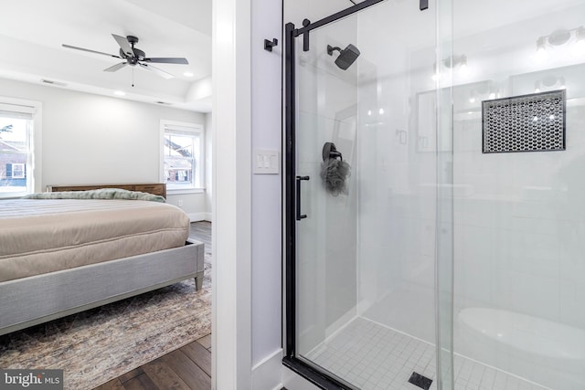 ensuite bathroom featuring wood finished floors, baseboards, recessed lighting, a stall shower, and ensuite bathroom