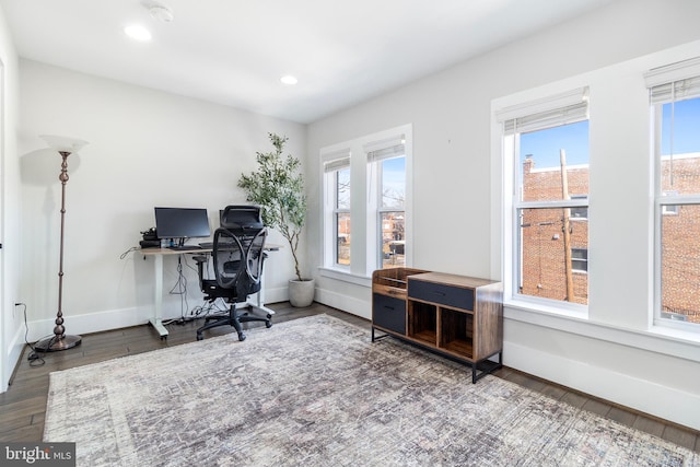 office space featuring recessed lighting, baseboards, plenty of natural light, and wood finished floors