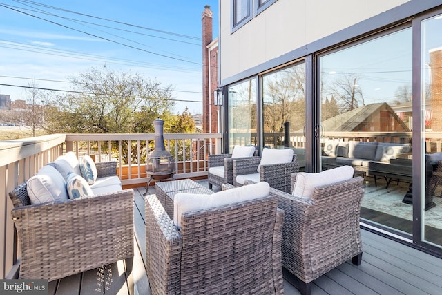 wooden deck featuring an outdoor hangout area