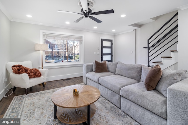 living room with baseboards, stairway, ornamental molding, recessed lighting, and wood finished floors