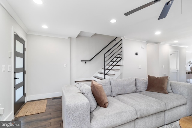 living room featuring recessed lighting, crown molding, baseboards, and dark wood-style flooring