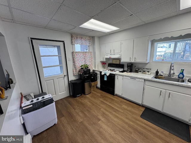 kitchen featuring light countertops, electric range, white cabinets, dishwasher, and under cabinet range hood