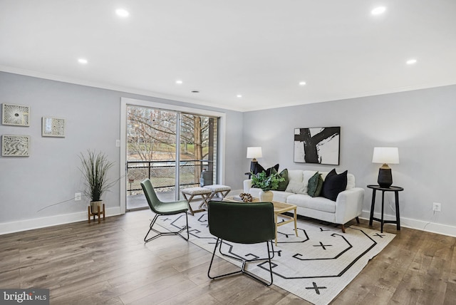 living room with ornamental molding and dark hardwood / wood-style floors