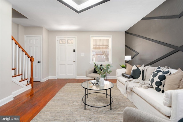 living room with dark hardwood / wood-style flooring