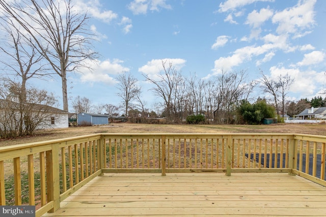 wooden terrace with an outbuilding