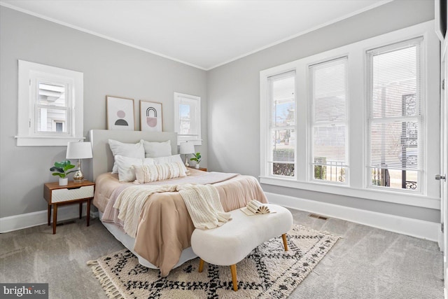 bedroom featuring crown molding and carpet flooring