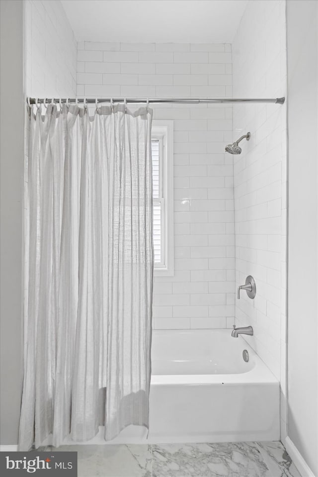 bathroom featuring shower / tub combo