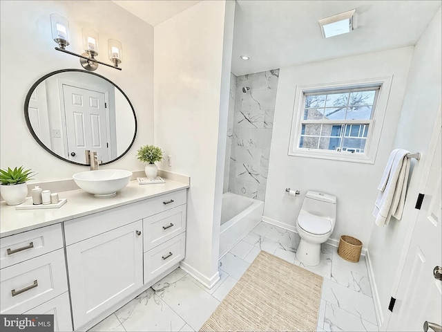 bathroom with marble finish floor, toilet, vanity, and baseboards