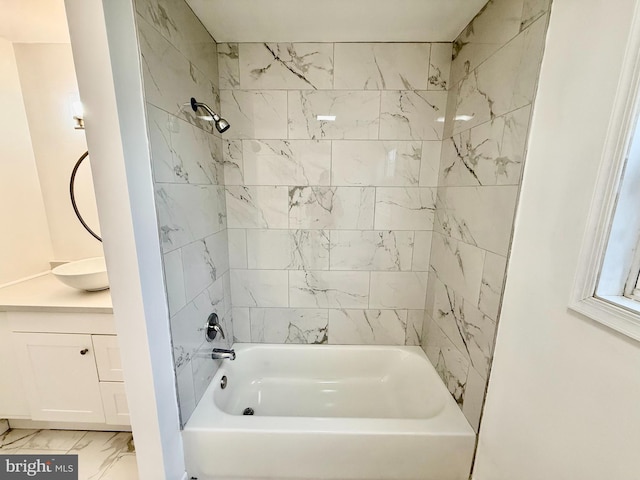 full bathroom featuring marble finish floor, vanity, and shower / bathing tub combination