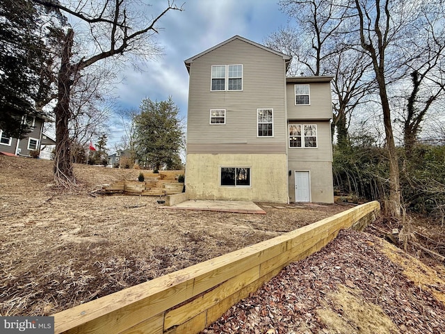 rear view of property with a patio area