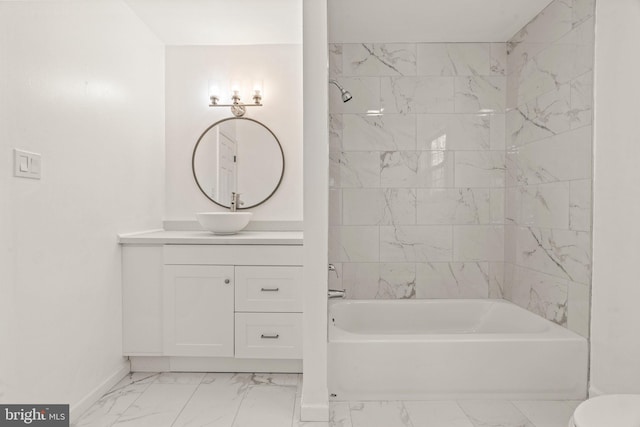 full bath featuring vanity, baseboards, shower / bath combination, toilet, and marble finish floor