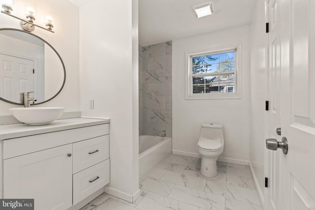 bathroom with baseboards, toilet, marble finish floor, and vanity