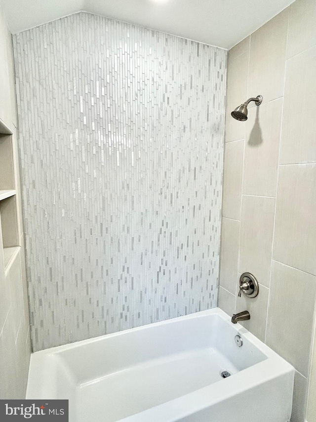 bathroom featuring washtub / shower combination