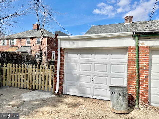 garage with fence