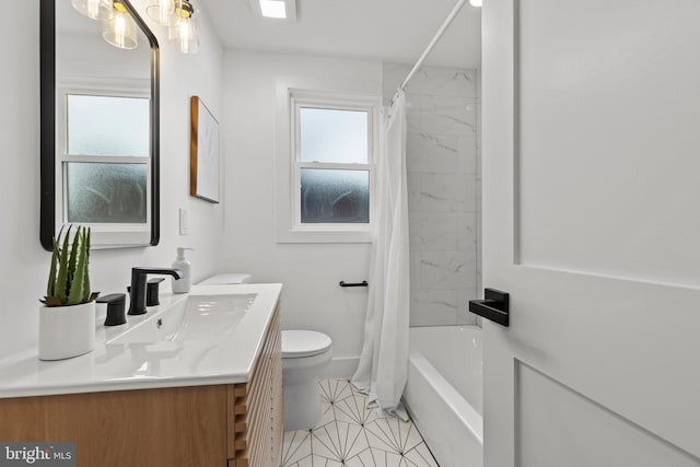 bathroom featuring toilet, shower / bath combination with curtain, vanity, and a wealth of natural light