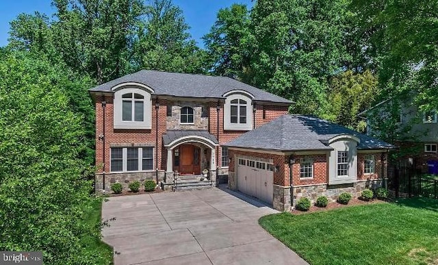 view of front of house featuring a garage, driveway, stone siding, and a front yard