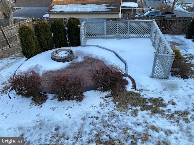 view of yard layered in snow