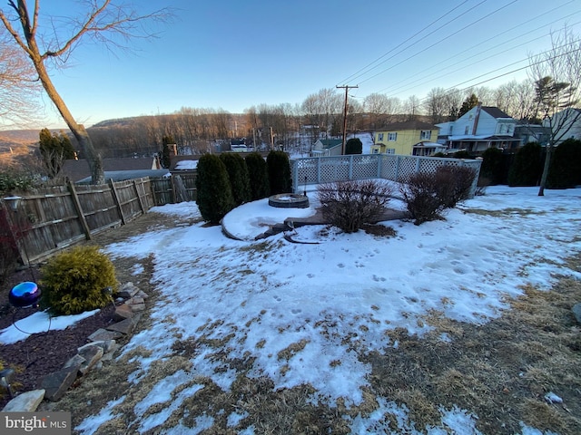 view of yard covered in snow