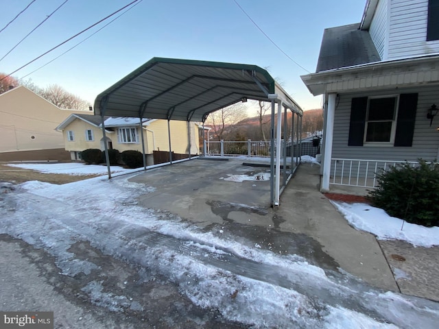 view of snow covered parking area