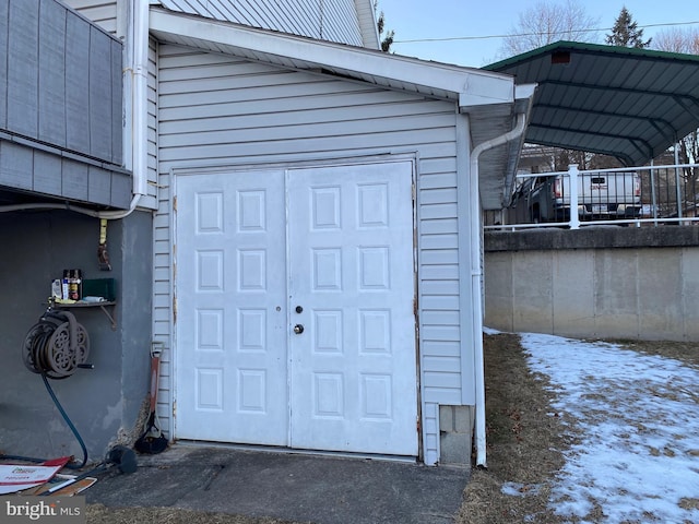 view of snow covered property entrance