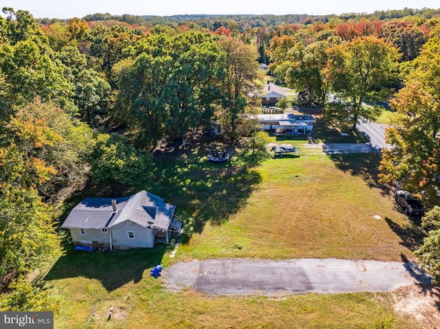 drone / aerial view with a view of trees