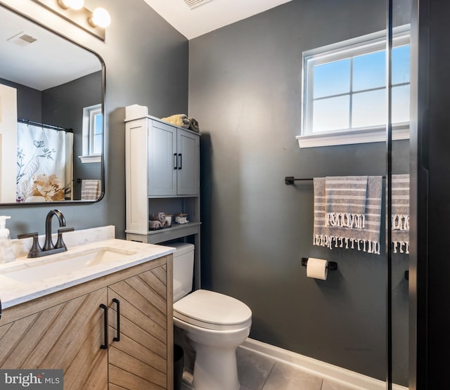 full bath with visible vents, toilet, vanity, tile patterned flooring, and baseboards