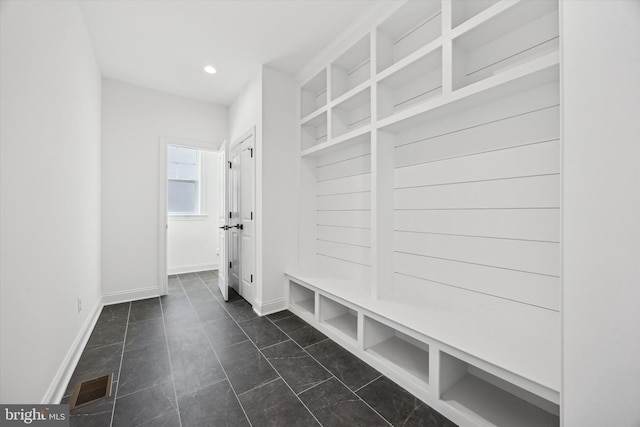 mudroom featuring baseboards, visible vents, and recessed lighting