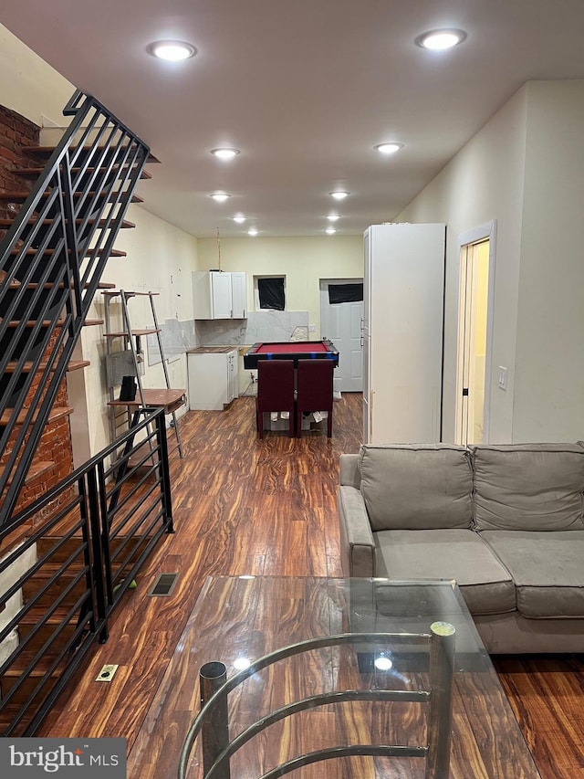 living room featuring dark hardwood / wood-style flooring