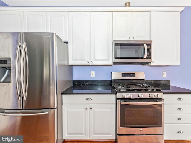 kitchen featuring white cabinetry and stainless steel appliances