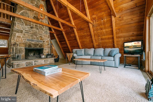 carpeted living area featuring wooden walls, wooden ceiling, beamed ceiling, a stone fireplace, and high vaulted ceiling