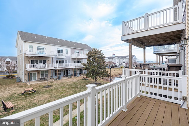 wooden terrace with central AC and a yard