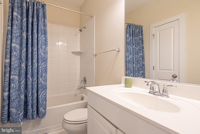 full bath featuring shower / bathtub combination with curtain, vanity, and toilet