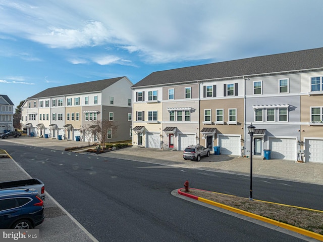 view of road with a residential view and curbs