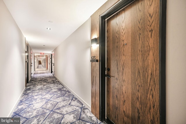 hallway featuring baseboards