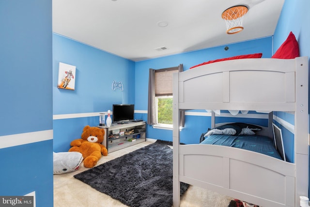 carpeted bedroom with visible vents