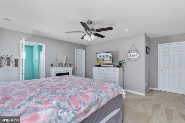 bedroom with light carpet, baseboards, visible vents, a ceiling fan, and a fireplace