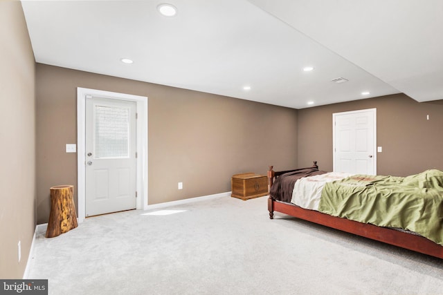 bedroom with baseboards, recessed lighting, and light colored carpet