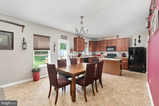 dining area with baseboards, a notable chandelier, and recessed lighting