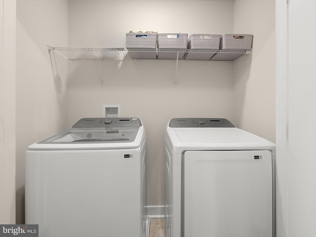 washroom featuring laundry area and washer and clothes dryer