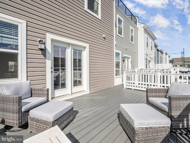 wooden terrace featuring outdoor lounge area