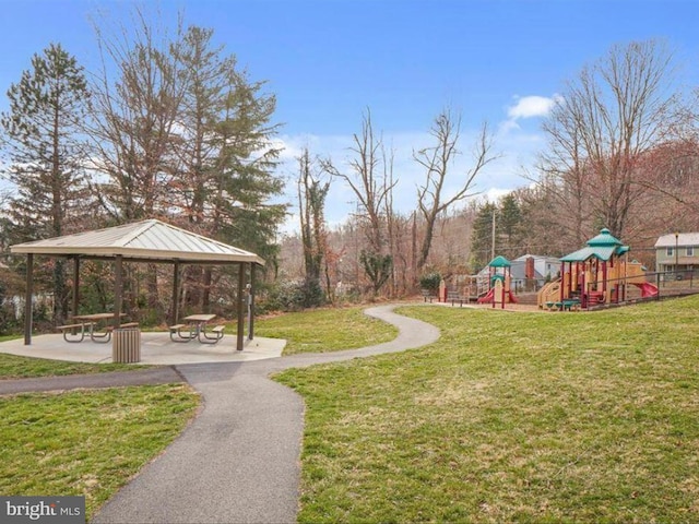 surrounding community featuring a lawn, playground community, and a gazebo