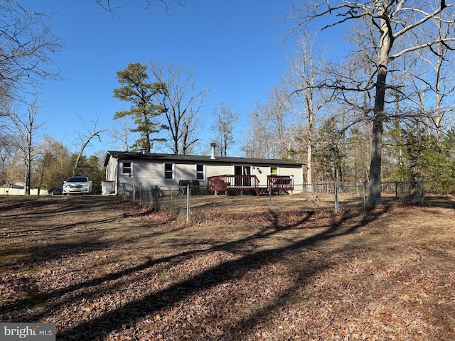 exterior space with a wooden deck and fence