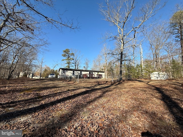 exterior space with an outbuilding and a shed