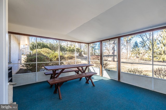 sunroom featuring lofted ceiling