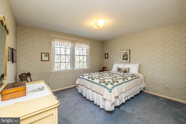 bedroom with baseboards, dark carpet, and wallpapered walls